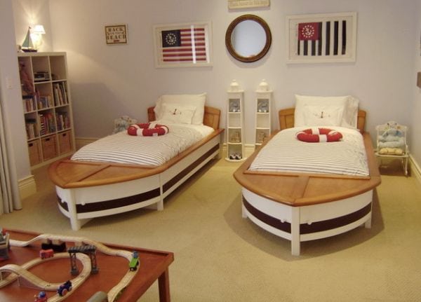 It-is-the-smartly-placed-mirror-that-completes-this-boys-bedroom-with-twin-sailboat-beds